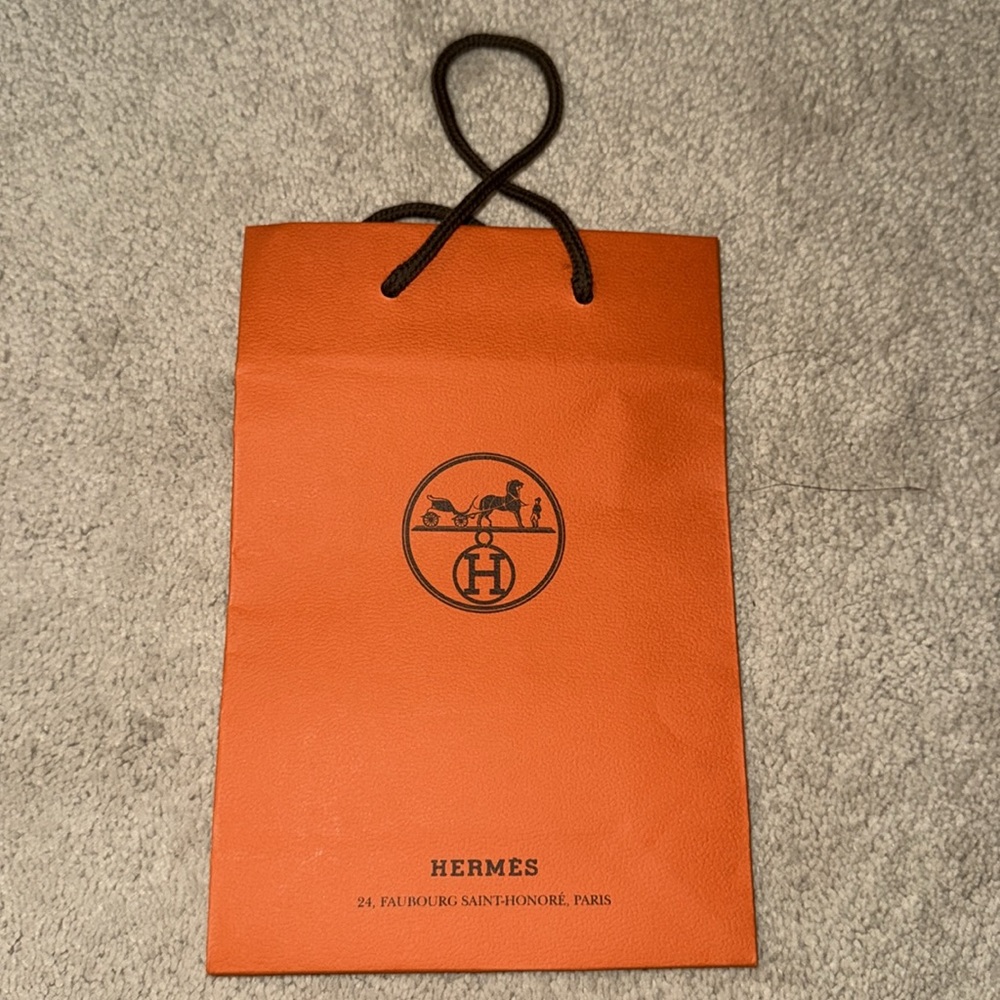 Hermès Vibrant Orange Bag with Black Handles